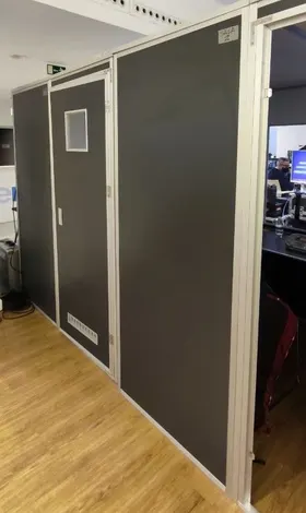 The row of soundproof interpreting booths in the conference venue.